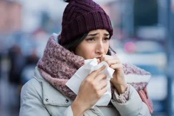 Woman with sore throat due to cold weather